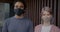 Portrait of Arab man and Caucasian woman wearing face mask during covid-19 pandemic