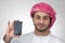 Portrait of an Arabian business man holding a phone for presentation