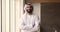 Portrait Arabian businessman in traditional Islamic attire pose in office