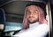 Portrait of an arabian man driving a car