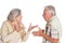 Portrait of arguing senior couple on white background