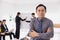 Portrait Asian adult smart businessman confident arm crossed. Business owner male standing with office worker planning management