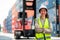 Portrait of Asian cargo container worker or technician stand with arm crossed and smile to camera in workplace area