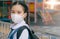 Portrait Asian children girl wear mask to protect PM 2.5 dust and air pollution. Portrait of Thai student wearing protection mask