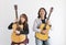 Portrait of Asian family duo band with two guitarist of father and daughter on white background for music, artist, musician