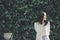 Portrait of asian girl with white shirt and skirt in outdoor nature vintage film style