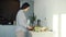 Portrait of Asian housewife cooking vegetable salad in kitchen busy with cookery