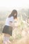 Portrait of asian japanese school girl costume looking at park outdoor in sunset