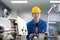 Portrait of Asian maintenance engineer workers working machines in the factory