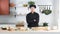 Portrait of Asian man chef wear black uniform smiling standing with arm crossed, making japanese food called takoyaki at kitchen