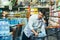 Portrait of an Asian man in crisis buying water in a supermarket