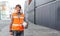 portrait of asian man smiling engineering in uniform holding hardhat and tablet standing containers yard. Area logistics import