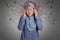 Portrait of Asian muslim lady wearing hijab hold her head in pain for stress emotional breakdown angry