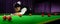 Portrait of Asian snooker player while aiming to white ball shoot to hit the red ball in game on snooker table. Banner size with