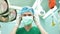 Portrait of Asian surgeon with medical mask standing in operation theater at a hospital. Team of Professional surgeons. Healthcare