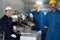 Portrait of Asian team maintenance engineer workers working machines in the factory.