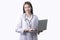 Portrait of Asian woman doctor wearing uniform holding laptop stand isolated on white background.