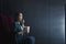 Portrait of asian woman with popcorn watching horror movie