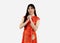 Portrait of a Asian woman in red traditional oriental costume with chinese greeting gestures Chinese new year concept