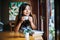 Portrait asian woman smiling relax in coffee shop