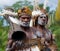 Portrait Asmat warrior with a tribal ritual drum.