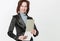 Portrait of an assistant woman with papers on white background