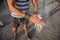 Portrait of an athlete`s hands applying weightlifting Chalk Powder for training with weights