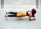 Portrait of athletic girl during workout, doing planks and squats