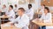 Portrait of an attentive man in group of students at lecture