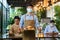 Portrait attractive asian waitress wear face mask and face shield holding food tray to serving meal to customer with custome in