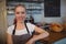 Portrait of attractive barista at cafe