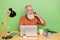 Portrait of attractive bearded cheery grey-haired man agent broker calling client consultation isolated over green color