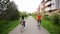 Portrait of attractive beautiful couple in casual outfits jeans overall riding retro bikes enjoying cycling together