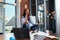 Portrait of attractive businesswoman practicing yoga sitting on desk at her workplace