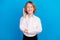 Portrait of attractive cheerful boy rising hand attending lesson  over bright blue color background