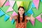 Portrait of attractive cheerful girl celebratory giving thumbup ad isolated on bright green color background