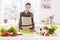 Portrait of attractive cheerful girl cooking tasty yummy salad traditional dinner at home light white interior indoors