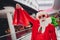 Portrait of attractive cheerful lucky Santa buying gifts presents surprise adventl day bargain at shopping mall indoors