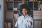 Portrait of attractive dark skinned young woman with curly Afro hairstyle extending hand for handshake. African american