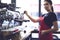 Portrait of attractive female barista working in cafeteria