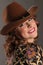 Portrait of attractive girl with angelic smile in cowboy hat