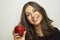 Portrait of attractive girl smiling with red apple in her hand healthy fruit