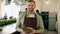 Portrait of attractive guy in apron standing in cooking class with bowl of tasty food