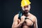 Portrait of attractive shirtless workman with drill
