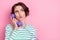 Portrait of attractive sullen worried funny girly girl talking on phone copy space news isolated over pink pastel color