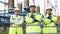 Portrait attractive three men engineers workers wearing safety uniform and hard hat crossing arms and looks at the