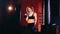 Portrait. Attractive woman boxer in boxing gym.