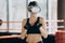 Portrait Attractive woman boxing in VR 360 headset training for kicking in virtual reality