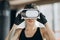 Portrait Attractive woman boxing in VR 360 headset training for kicking in virtual reality