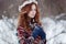 Portrait of attractive young redheaded woman in a white wreath